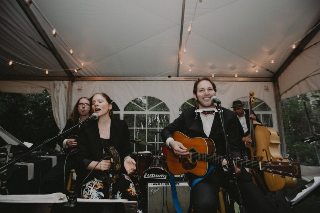 Loyales performing in a summer tent wedding