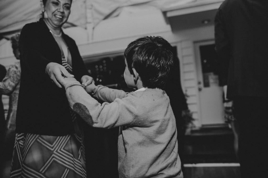 young boy and mother dancing wedding
