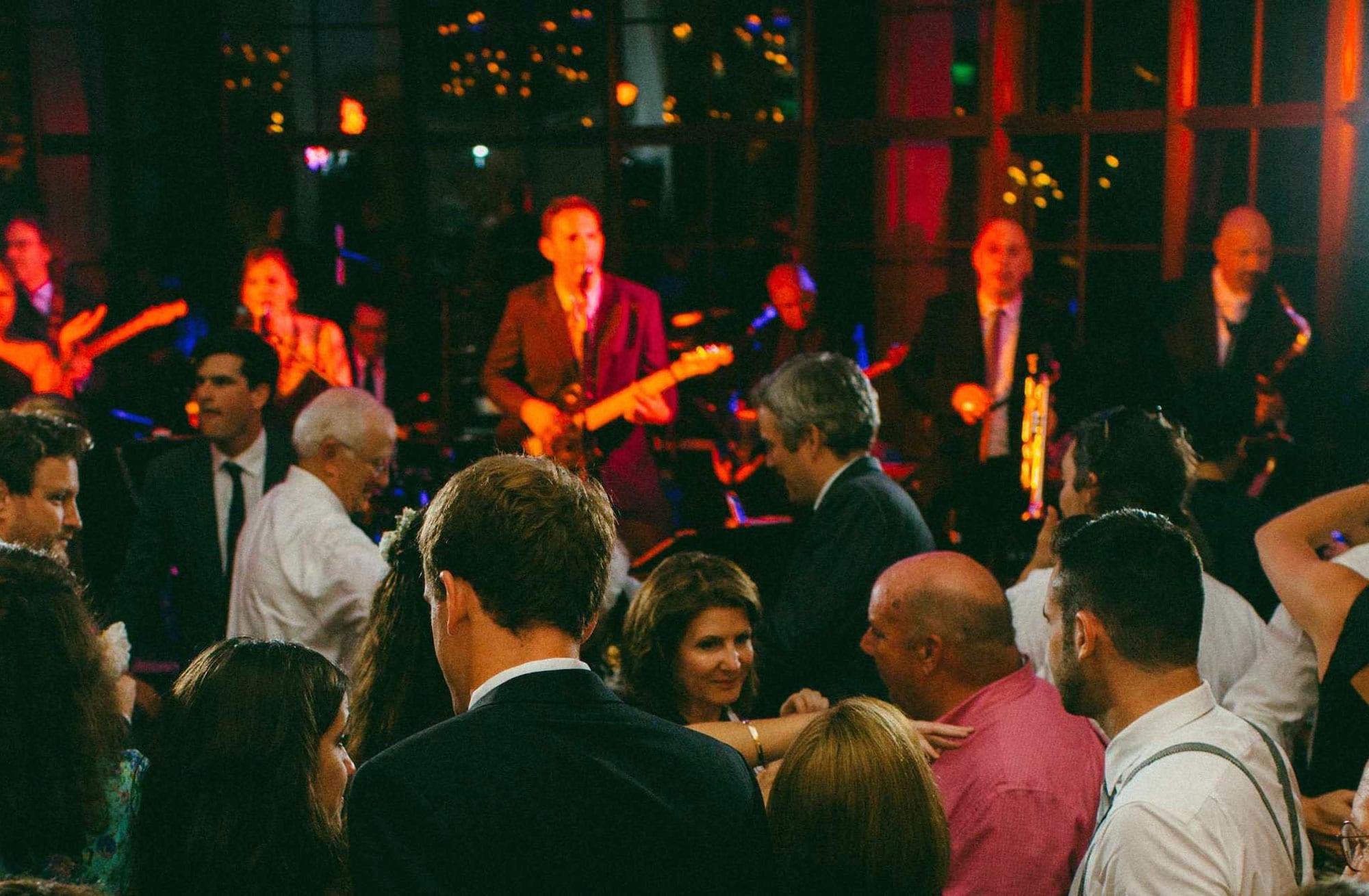 Loyales performing in front of a crowd at an NYC wedding